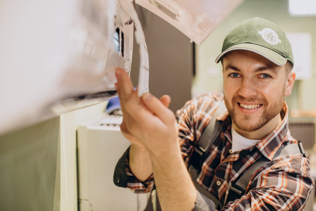 repairman-doing-air-conditioner-service-min